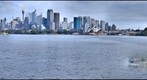 View of Sydney Harbor and the Opera house from Cremorne Reserve.
