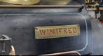Winifred's driver's side nameplate