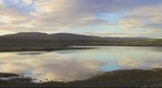 Loch Dunvegan, Isle of Skye, Scotland, taken in early morning and looking N.W.   Macleods Tables (the flat topped mountains) to the left and Dunvegan village to the right.
