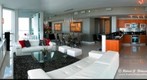 The Grand Room and Kitchen of a 3 Bedroom Apartment at the Vizcayne Condos in Miami, Florida
