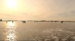 Sunset at frozen lake
