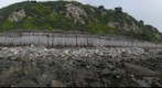 100223 west Haskell beach to Ellwood Coal Oil Pt Sandpiper bluffs from low tide shore rock Goleta California