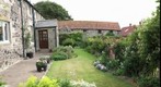GP91 Howburn Farmhouse Northumberland. Front Garden