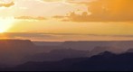 Grand Canyon - sun setting behind the clouds