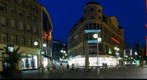 Cologne, Germany at night. Beer fountain, where pedestrian zones Schildergasse and Hohe Strasse meet.