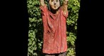 Wooden boy with golden ball