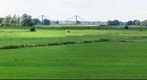 Panorama view on grasslands and river Waal