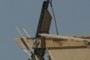 Arm raising mechanism