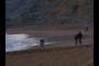 people strolling on beach