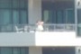 Kid Climbing on Balcony Rail