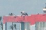 Man on top of a house