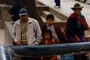 Family waiting at bus stop