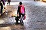 Woman with wheelbarrow