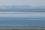 A boat on its way out