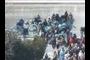 Onlookers on horseback