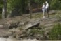 couple by riverbank