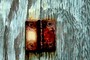 Rusted hinge and green wood