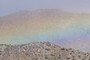 Ridge with rainbow backdrop