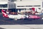 Photo of the Pink Qantas Bombardier 72-seat Q400s