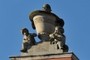 Stone vase guarded by cupids