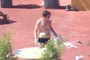 Another worker, almost naked