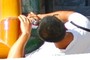 A man with a Canon IXUS 95 IS digital camera.
