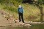 Boy on river shore
