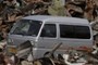 Man drives van in rubble