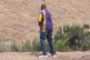 Man walking on a large rock