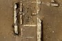 Ancient adobe walls, trash, and human feces