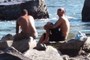 Guys tanning their backs