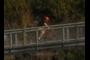Biking up the pedestrian bridge